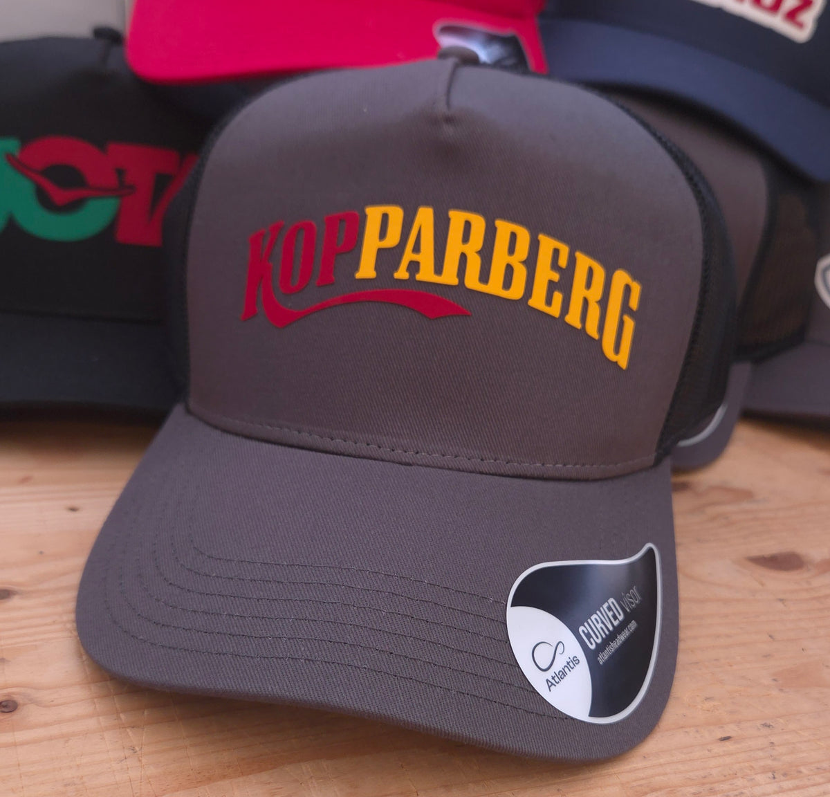 Kopparberg-style cap with 3D rubberised logo, available in black, grey/black, red or navy/white