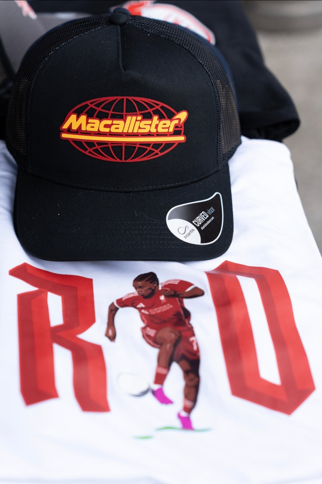 Rio Ngumoha T-shirt celebrating Liverpool's teenage winger, available in black or white